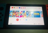 Nintendo switch cracké avec 12 jeux et chargeur d’origine